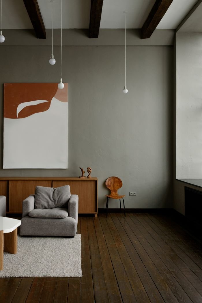 Stylish minimalist living room with modern furniture and neutral tones.